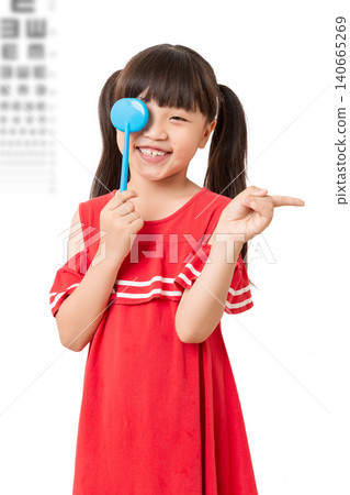 Asian little girl eye test, covering one eye, vision examination, child healthcare, ophthalmology concept 140665269
