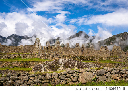 Panoramic view of Machu Picchu ruins with Huayna Picchu in background, Peru Panoramic view of Machu Picchu ruins with Huayna Picchu in background, Peru 140665646