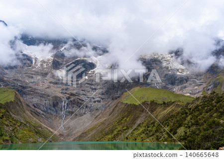 Emerald waters of Laguna Humantay surrounded by Andean mountains in Peru Emerald waters of Laguna Humantay surrounded by Andean mountains in Peru 140665648