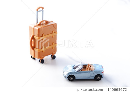 Road Trip - An image of setting off on a road trip in a two-seater convertible with suitcases. 140665672