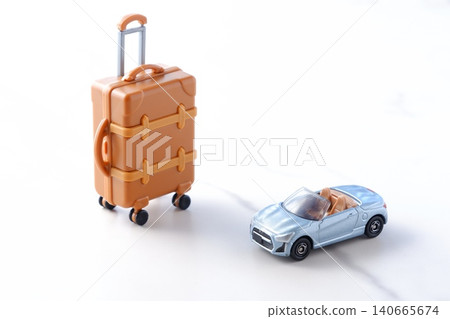 Road Trip - An image of setting off on a road trip in a two-seater convertible with suitcases. 140665674