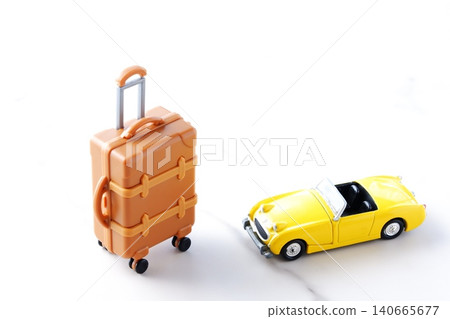 Road Trip - An image of setting off on a road trip in a two-seater convertible with suitcases. 140665677