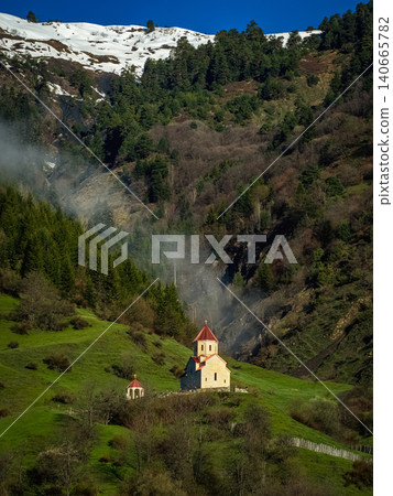 Orthodox church located in the Mestia municipality of the Svaneti region in Georgia. Vertical view. Orthodox church located in the Mestia municipality of the Svaneti region in Georgia. Vertical view. 140665782
