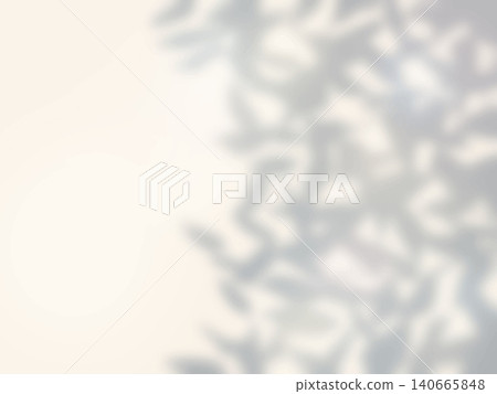 A background image showing the shadow of a tree cast on a beige wall. A background image showing the shadow of a tree cast on a beige wall. 140665848
