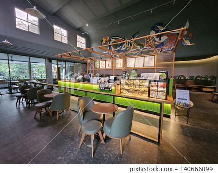 Modern coffee shop interior featuring a vibrant illuminated green service counter, stylish wooden bar. Modern coffee shop interior featuring a vibrant illuminated green service counter, stylish wooden bar. 140666099