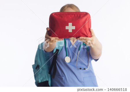 Healthcare Worker Presenting Emergency First Aid Kit Healthcare Worker Presenting Emergency First Aid Kit 140666518