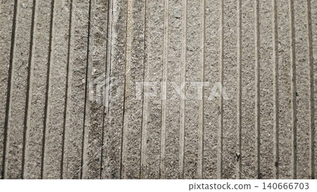 Grey natural stone texture background with vertical grooved lines. Grey natural stone texture background with vertical grooved lines. 140666703