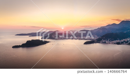 Aerial sunset panorama of Budva Riviera coastline with Sveti Nikola Island and Adriatic Sea in Montenegro Aerial sunset panorama of Budva Riviera coastline with Sveti Nikola Island and Adriatic Sea in Montenegro 140666764