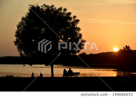 silhouettes of people on sunset background 140666833