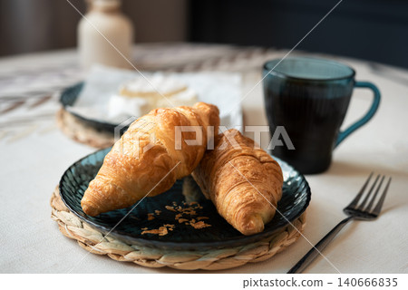 Fresh buttery croissants on plate for breakfast Fresh buttery croissants on plate for breakfast 140666835
