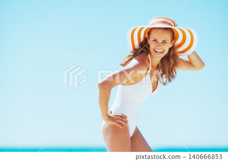young woman in hat on beach young woman in hat on beach 140666853