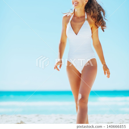 Happy young woman on beach Happy young woman on beach 140666855