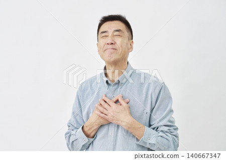 A man feeling relieved on a white background A man feeling relieved on a white background 140667347