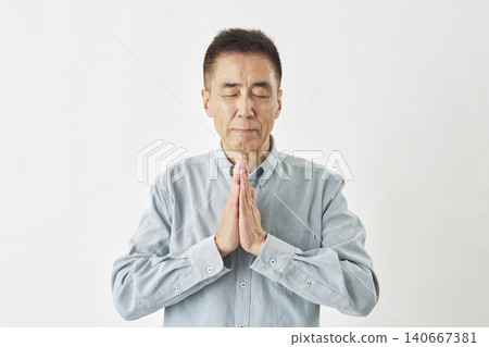 Man praying on white background Man praying on white background 140667381