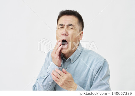Man with toothache on white background Man with toothache on white background 140667389