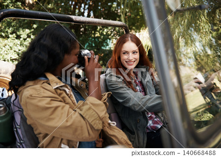 Friends, smile and photograph in car for road trip with travel women outdoor together for adventure. Camera, memory and vacation with happy young people in vehicle for transport on summer holiday 140668488