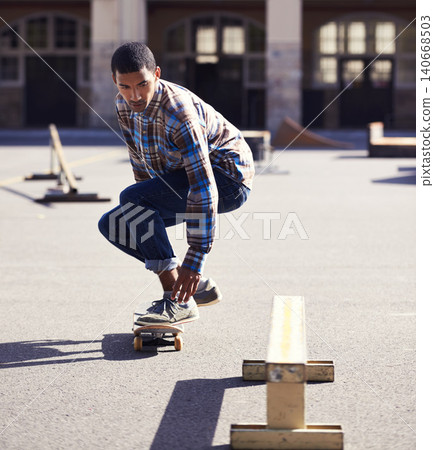 Man, skateboard and riding at urban skatepark, sports and energy with skill, stunt and recreation activity outdoor. Skateboarder, technique and trick, training and workout for balance and exercise Man, skateboard and riding at urban skatepark, sports and energy with skill, stunt and recreation activity outdoor. Skateboarder, technique and trick, training and workout for balance and exercise 140668503