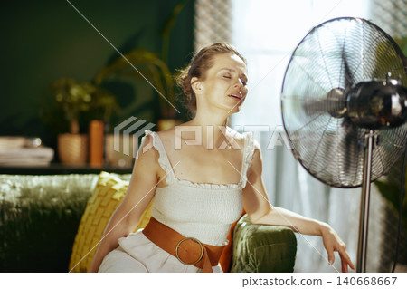 Close-Up of Woman Finding Relief from Heat 140668667