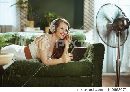 Relaxed Woman Enjoying Digital Media at Home 140668671
