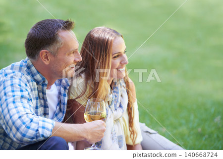 Couple, travel and wine for bonding in outdoor nature, love and romance in relationship on weekend. Alcohol, conversation and people on date in countryside, adventure and relax on grass for vacation 140668724