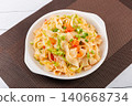 Stir-fried Chinese knife-cut noodles with fresh tomatoes, scrambled eggs, and green onions 140668734