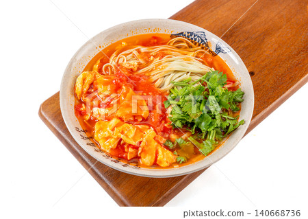 Nutritious mung bean noodles in a rich tomato and egg soup, garnished with fresh cilantro Nutritious mung bean noodles in a rich tomato and egg soup, garnished with fresh cilantro 140668736