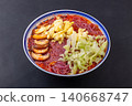 Vibrant purple sweet potato noodles served in a rich tomato sauce, topped with eggs and fresh lettuce 140668747