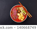 Vibrant purple sweet potato noodles served in a rich tomato sauce, topped with eggs and fresh lettuce 140668749