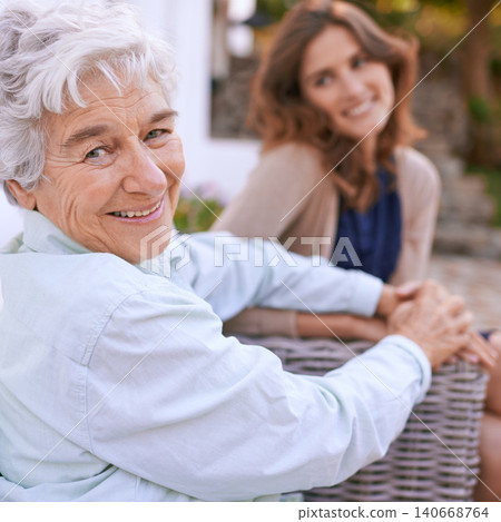 Portrait, elderly and mother together with daughter in nursing home, outdoor and woman to visit wise mom. Girls, smile and holding hands as family, happy and retirement of senior female person Portrait, elderly and mother together with daughter in nursing home, outdoor and woman to visit wise mom. Girls, smile and holding hands as family, happy and retirement of senior female person 140668764