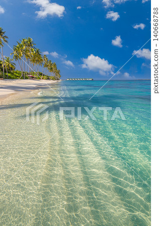 Tropical palm shadows stretching white sand. Vertical turquoise lagoon bright summer shore. Artistic shadow pattern serene paradise, peaceful island holiday escape Tropical palm shadows stretching white sand. Vertical turquoise lagoon bright summer shore. Artistic shadow pattern serene paradise, peaceful island holiday escape 140668788