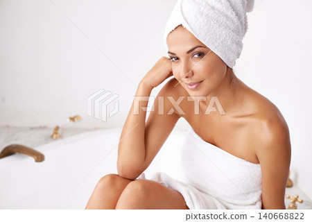 Beauty, towel and portrait of woman in bathtub for facial treatment, wellness and cosmetics. Smile, cleaning and face of female person for natural skin, grooming and dermatology in apartment 140668822