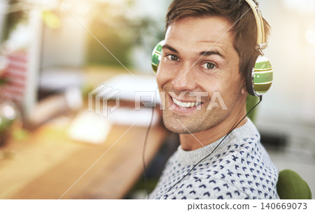 Portrait, office and headphone for happy male worker, music or podcast for entertainment. Smile, employee and listening or working at workspace in Holland, startup or entrepreneur for tech company Portrait, office and headphone for happy male worker, music or podcast for entertainment. Smile, employee and listening or working at workspace in Holland, startup or entrepreneur for tech company 140669073