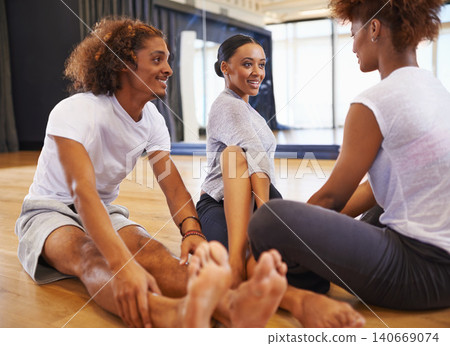 Dancer, class and people stretching legs on floor to start rehearsal together in studio or academy. Training, practice and healthy exercise for fitness and friends in school with yoga or pilates Dancer, class and people stretching legs on floor to start rehearsal together in studio or academy. Training, practice and healthy exercise for fitness and friends in school with yoga or pilates 140669074