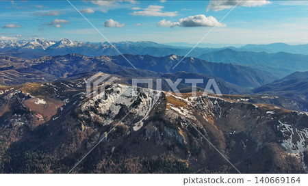 Snow capped mountains under blue sky in spring Snow capped mountains under blue sky in spring 140669164
