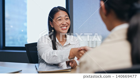 Business, woman and handshake in job interview for introduction in meeting with smile or excited in office. Asian candidate, hr employee or shaking hands with documents for hiring deal or recruitment Business, woman and handshake in job interview for introduction in meeting with smile or excited in office. Asian candidate, hr employee or shaking hands with documents for hiring deal or recruitment 140669477