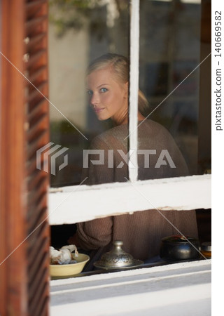 Portrait, woman and smile by window for relax with reflection, weekend break and calm expression in home. Person, face and happy with confidence, pride and casual clothes in apartment in winter Portrait, woman and smile by window for relax with reflection, weekend break and calm expression in home. Person, face and happy with confidence, pride and casual clothes in apartment in winter 140669582