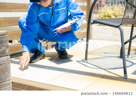 Workers inspecting wooden decks and partitions. Workers inspecting wooden decks and partitions. 140669612