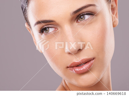 Woman, studio and thinking with beauty, skincare and gloss for makeup and glamour model in face zoom. Female person, eyebrow and glow for lipstick, foundation and isolated on grey background cosmetic Woman, studio and thinking with beauty, skincare and gloss for makeup and glamour model in face zoom. Female person, eyebrow and glow for lipstick, foundation and isolated on grey background cosmetic 140669618