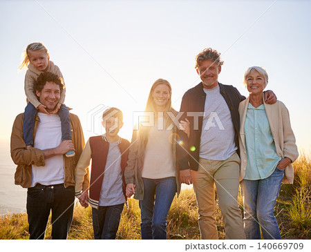 Grandparents, parents and children portrait in nature, summer fun in countryside. Exercise, kids and generations holding hands, happy in field on vacation with family together in calm outdoors Grandparents, parents and children portrait in nature, summer fun in countryside. Exercise, kids and generations holding hands, happy in field on vacation with family together in calm outdoors 140669709