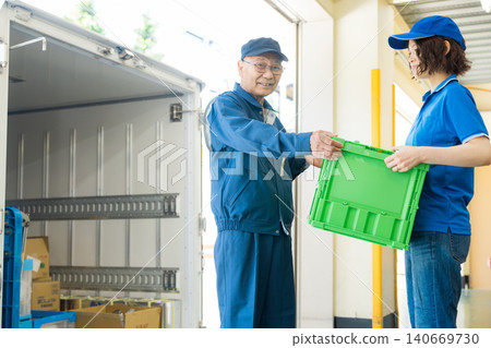 Worker standing in front of the truck Worker standing in front of the truck 140669730