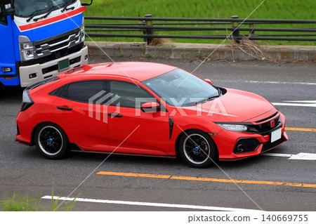 Red domestic sports car Red domestic sports car 140669755