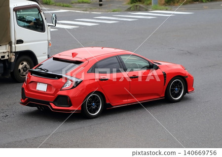 Red domestic sports car Red domestic sports car 140669756