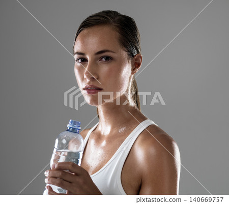 Woman, portrait and fitness with water bottle for hydration, sweat or workout on a gray studio background. Face of female person or athlete with liquid or drink for exercise in health and wellness Woman, portrait and fitness with water bottle for hydration, sweat or workout on a gray studio background. Face of female person or athlete with liquid or drink for exercise in health and wellness 140669757