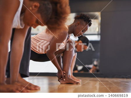 Dancer, group and stretching legs in studio for workout, exercise or vision for wellness with muscle. People, friends and dancing team in warm up, start or together for class, art and ballet on floor 140669819