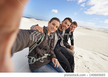 Friends, smile and selfie in desert for adventure on holiday, road trip and travel together in California. People, happy and excited in sand dunes for vacation or break with bonding for memory. Friends, smile and selfie in desert for adventure on holiday, road trip and travel together in California. People, happy and excited in sand dunes for vacation or break with bonding for memory. 140669885