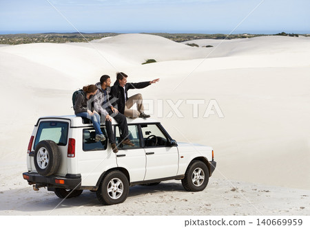 Friends, people on car in desert and travel for tourism in Dubai for safari, road trip and view. Adventure, journey and transportation with offroad vehicle or 4x4 on vacation for break outdoor Friends, people on car in desert and travel for tourism in Dubai for safari, road trip and view. Adventure, journey and transportation with offroad vehicle or 4x4 on vacation for break outdoor 140669959