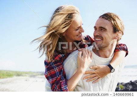 Happy couple, love and bonding together in nature, piggyback and romantic getaway on holiday by blue sky. Man, woman and care on vacation on weekend break, hugging and travel in outdoor on honeymoon Happy couple, love and bonding together in nature, piggyback and romantic getaway on holiday by blue sky. Man, woman and care on vacation on weekend break, hugging and travel in outdoor on honeymoon 140669961