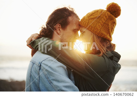 Hug, outdoor and couple with love, sunshine and lens flare with holiday for embrace or honeymoon. Romance, relationship or man with woman or happiness with vacation or journey with journey or date 140670062
