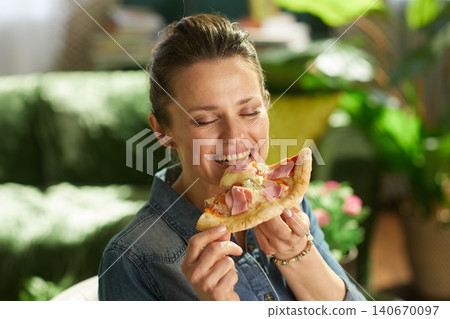 Woman Enjoying Pizza Lunch at Home Woman Enjoying Pizza Lunch at Home 140670097