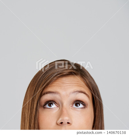 Studio, head and closeup with eyes, thinking and mockup for idea or vision. Woman, planning and memory with optimism, positive and hopeful for future contemplating isolated on white background Studio, head and closeup with eyes, thinking and mockup for idea or vision. Woman, planning and memory with optimism, positive and hopeful for future contemplating isolated on white background 140670138